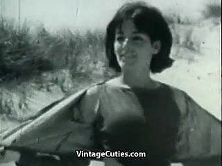 Nudist Girl's Day insusceptible to a Beach (1960s Vintage)